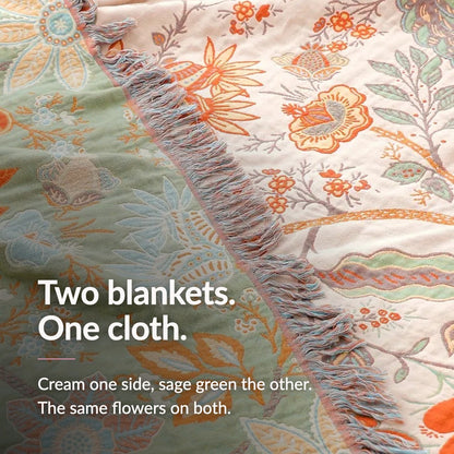 Claim card reading Two blankets. One cloth. Over a close photograph of the cream face and the sage green face meeting at the fringed edge.